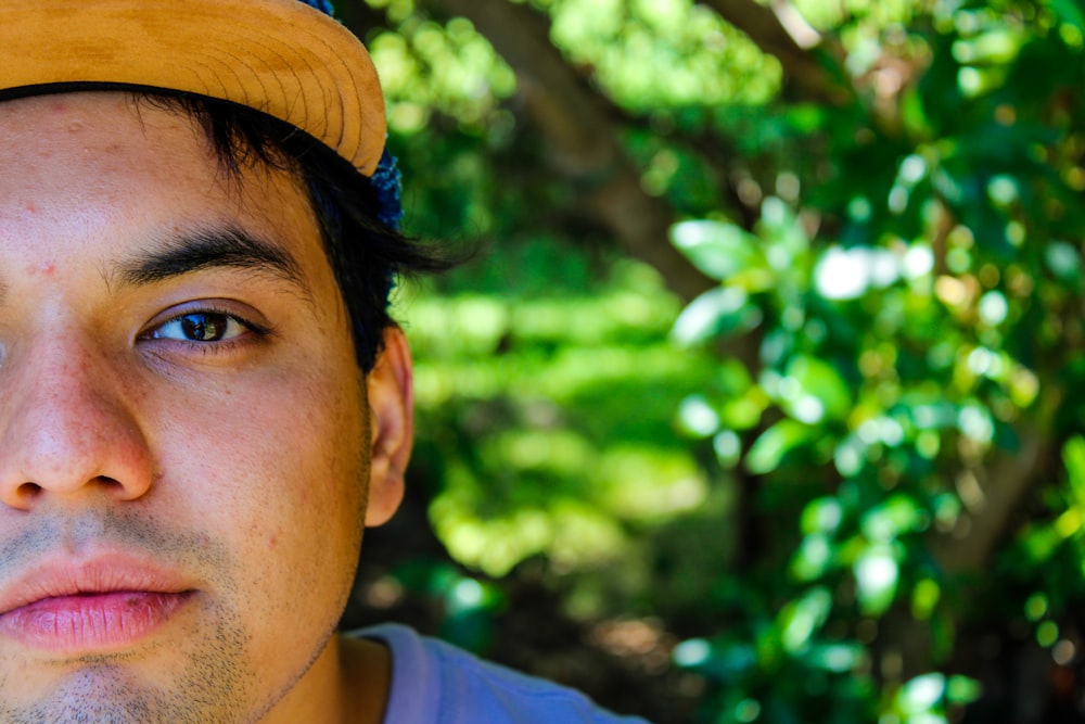 a close up of a person wearing a hat