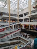a mall filled with lots of people walking around