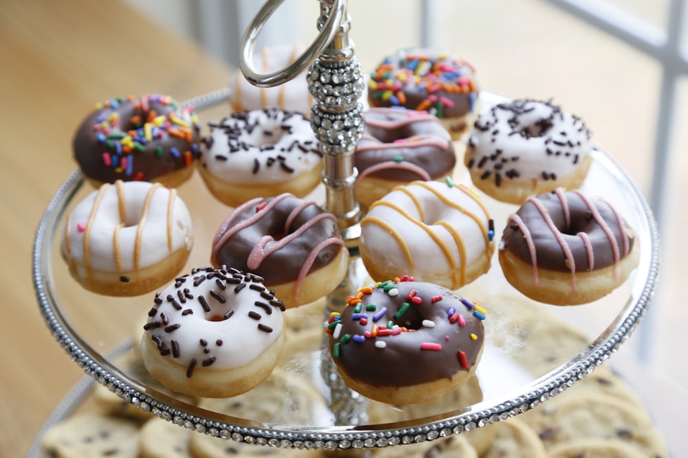a tray with a variety of donuts on it