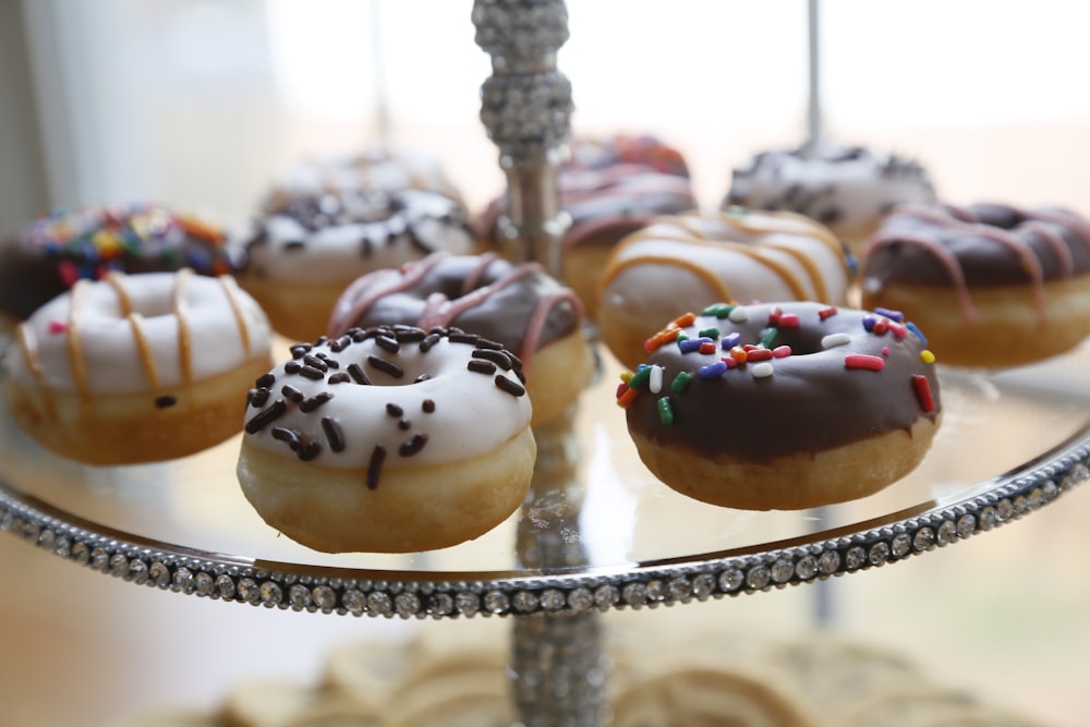 a tray with a variety of donuts on it