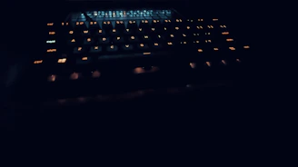 Shiny keyboard with glowing keys in a cozy music room