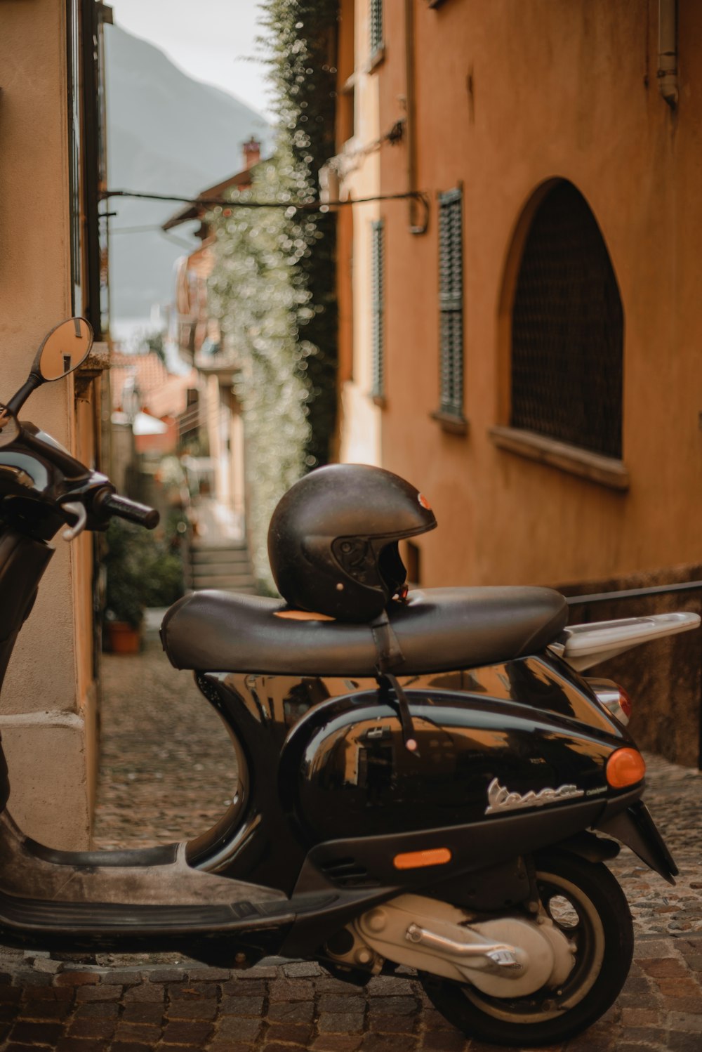 a motor scooter parked in front of a building