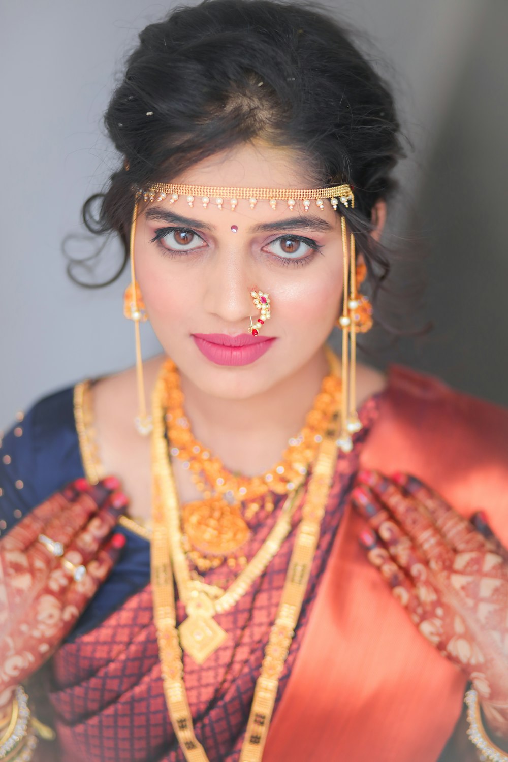 a woman in a red and gold outfit