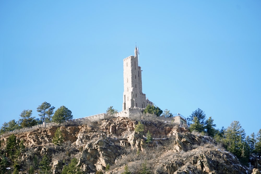 a very tall tower on top of a mountain