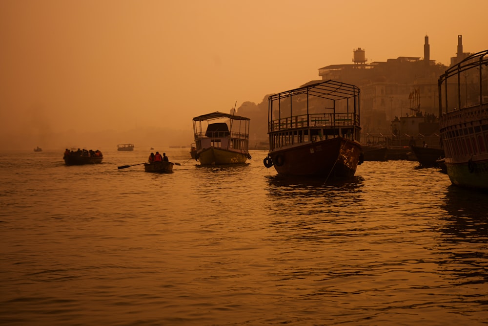 a group of boats floating on top of a body of water