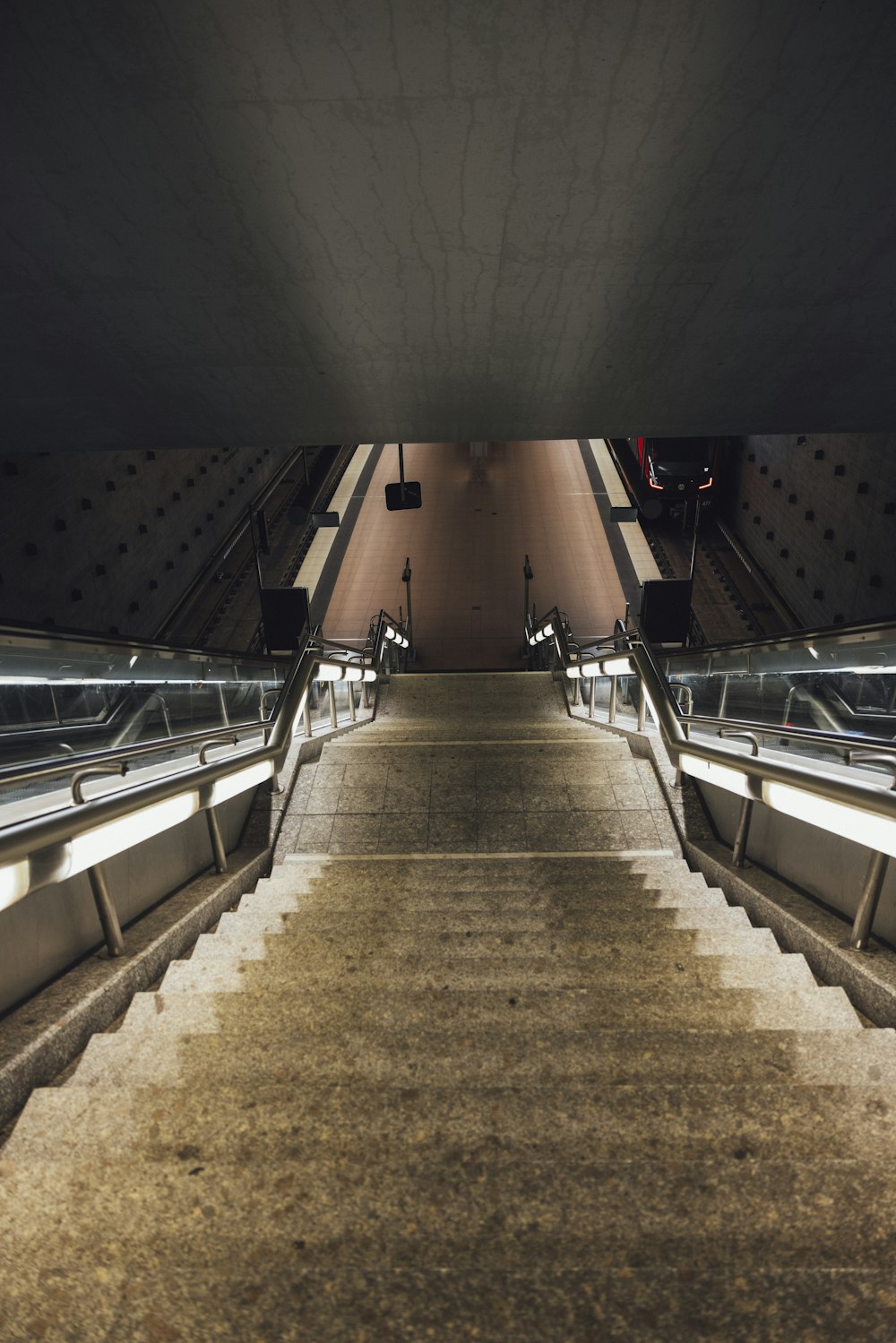 a very long set of stairs leading up to an escalator