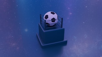 A soccer ball is placed atop a small pedestal encircled by a miniature wrestling ring. The background is a starry blue gradient, giving the scene an otherworldly appearance with a touch of mystery.