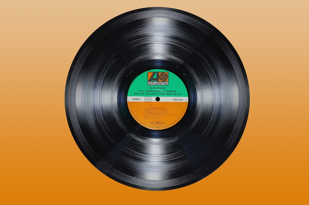 a black record on a yellow background