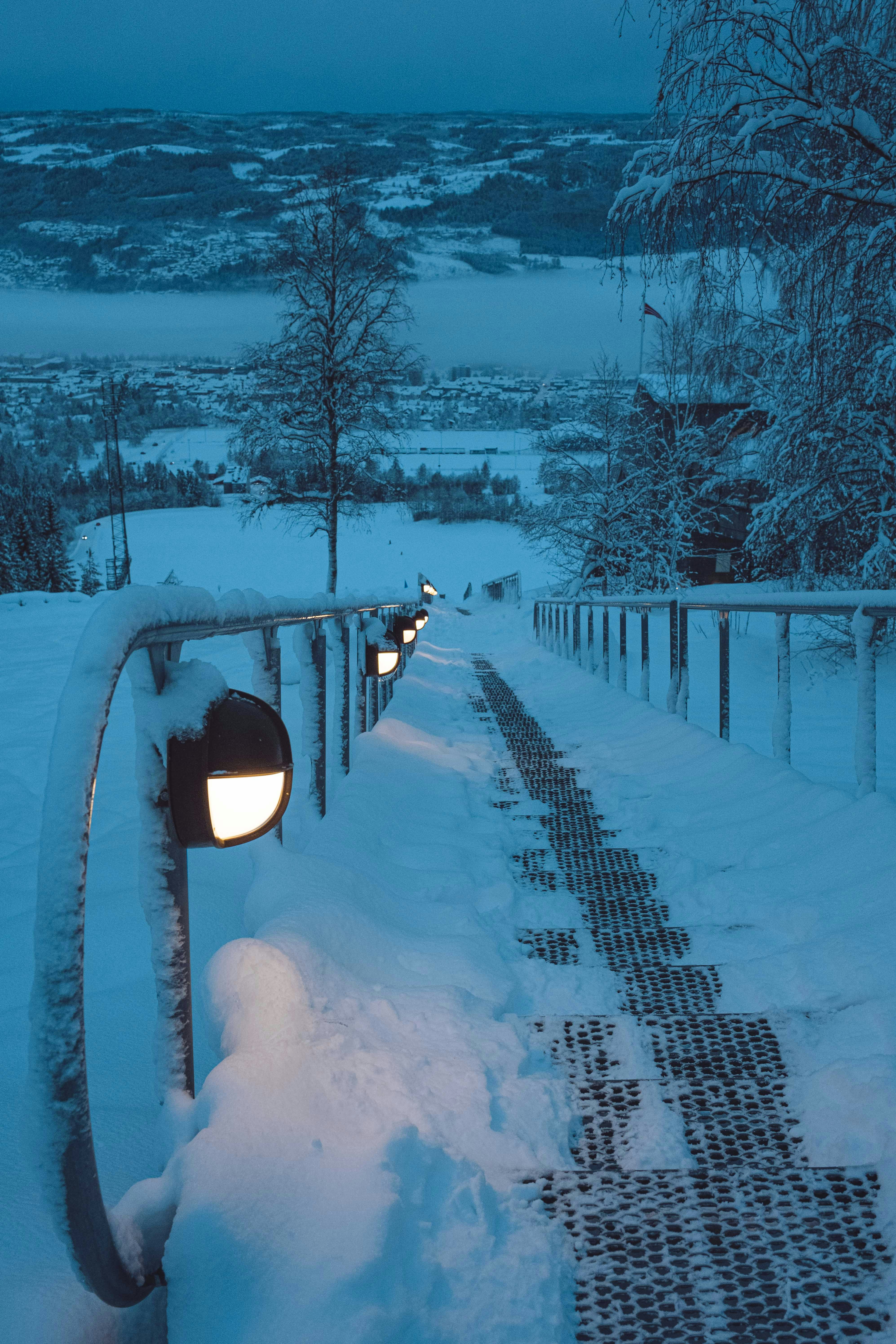 A snowy path with a street light on it photo – Free Nature Image on ...
