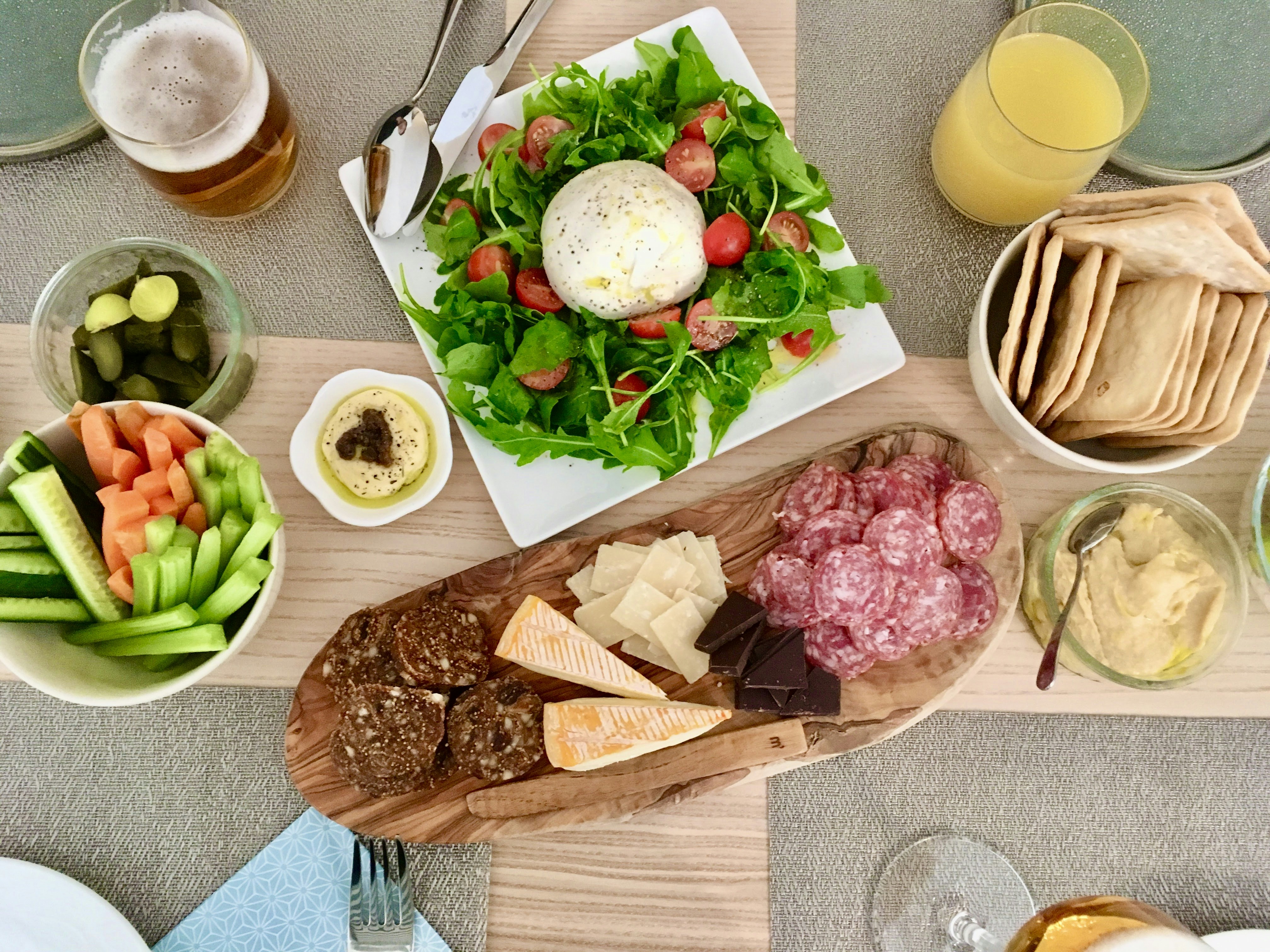 a table topped with plates of food and drinks