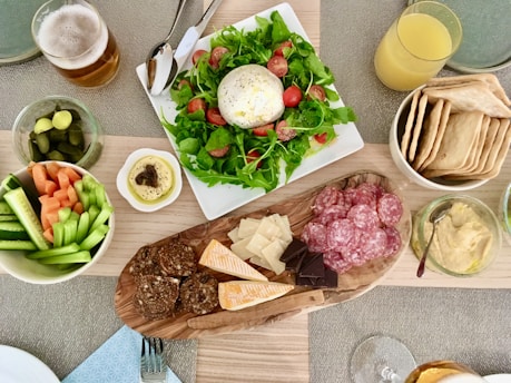 a table topped with plates of food and drinks