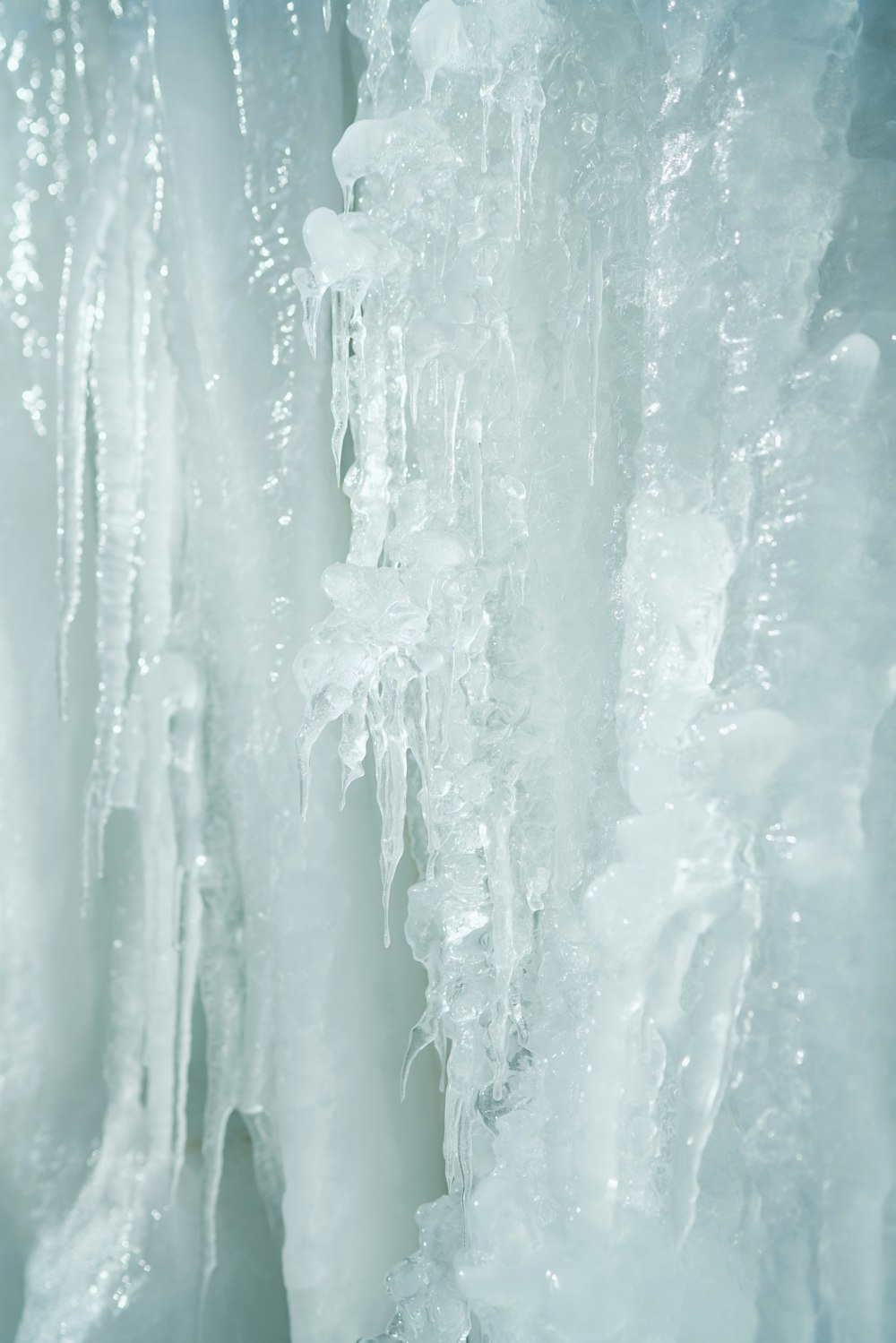 a close up of ice and icicles on a wall