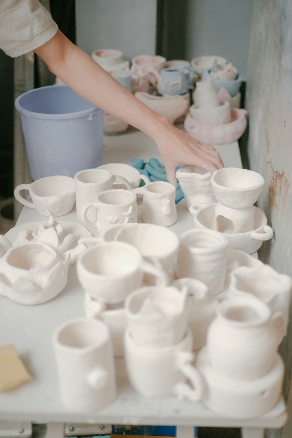 a table with a lot of white cups on it