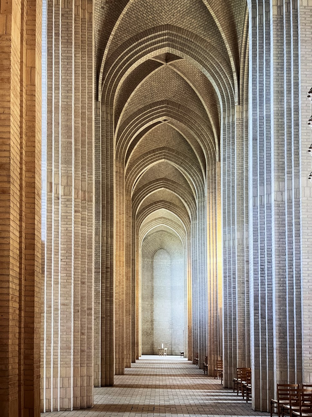 a large cathedral with a row of benches