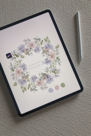 A beautifully designed wedding ebook displayed on a tablet with floral accents.
