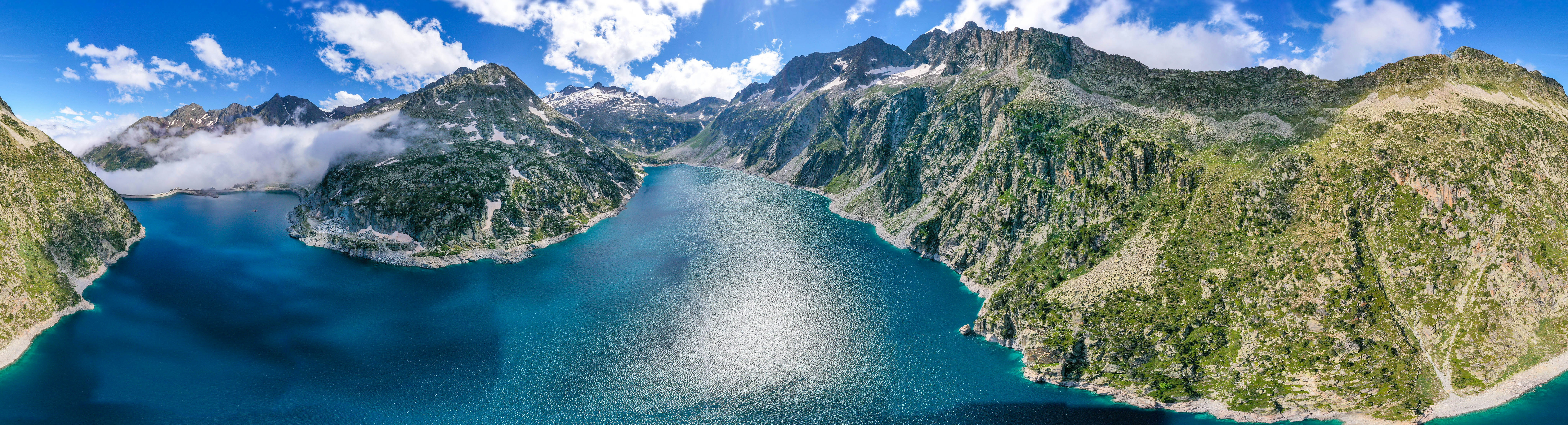 an aerial view of a mountain range and a body of water