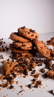 a pile of cookies and chocolate chips on a table