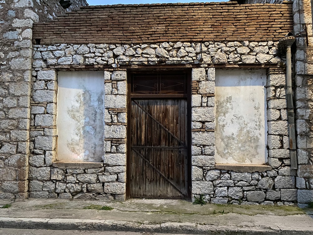 an old stone building with a wooden door