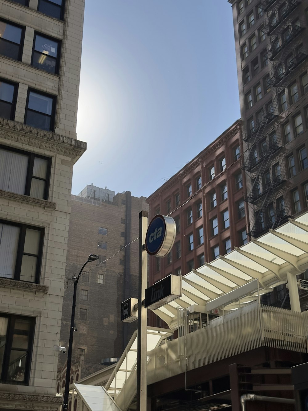 the sun is shining over a city street