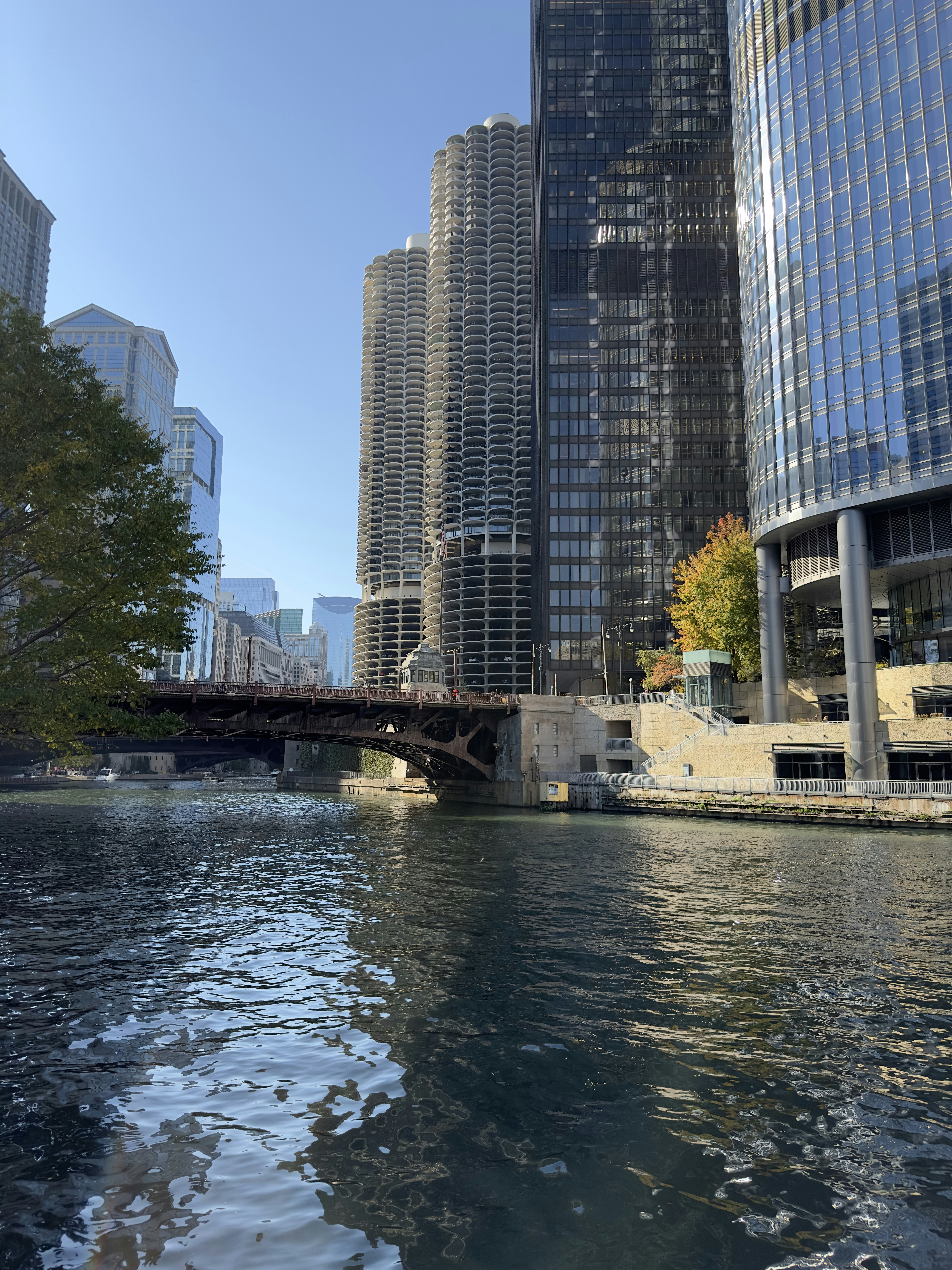 a body of water in front of tall buildings