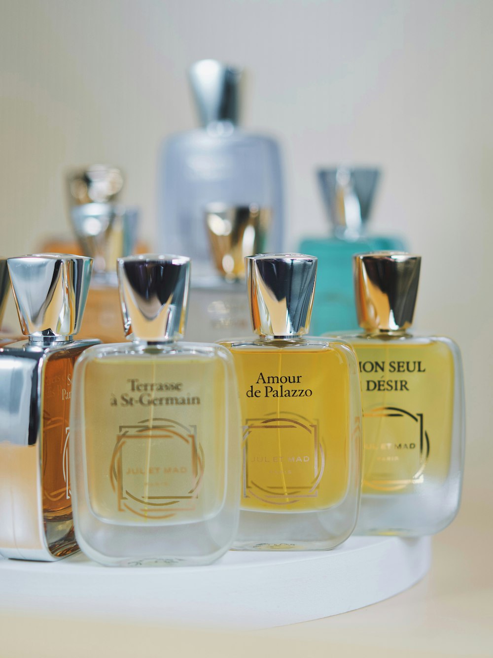 a group of bottles of perfume sitting on top of a table