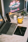 A cozy workspace featuring various tech gadgets and products.
