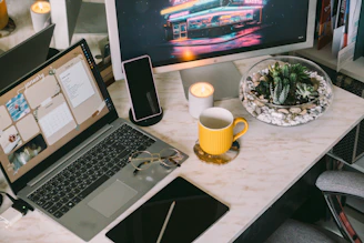 a laptop computer sitting on top of a desk