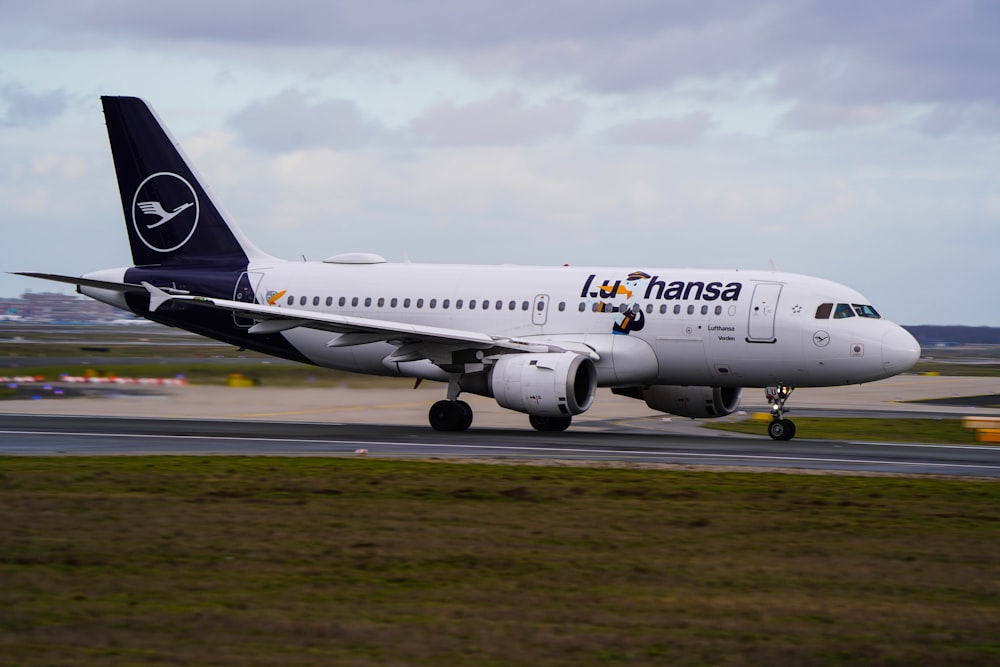 a large jetliner sitting on top of an airport runway