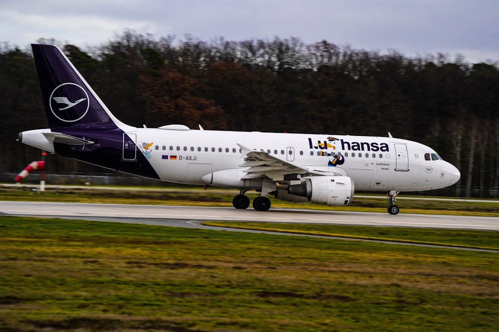 a large jetliner sitting on top of an airport runway