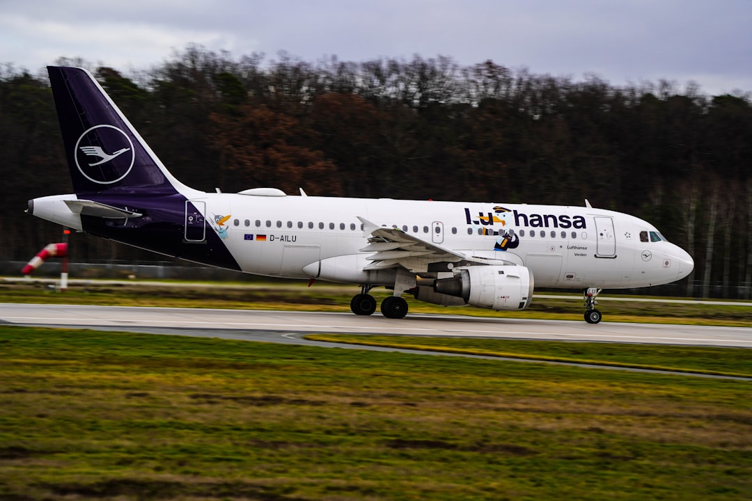 a large jetliner sitting on top of an airport runway,