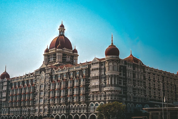 A panoramic view of the hotel’s exterior set against a clear blue sky.