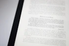 A close-up image of a book page with text focusing on meditation and scriptural interpretation. The text is primarily in black font, with some headings in a larger or bold type. The page is well-lit, capturing the details of the printed words.