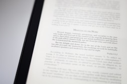 A close-up image of a book page with text focusing on meditation and scriptural interpretation. The text is primarily in black font, with some headings in a larger or bold type. The page is well-lit, capturing the details of the printed words.