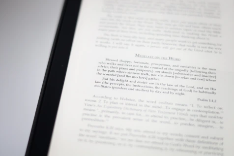 A close-up image of a book page with text focusing on meditation and scriptural interpretation. The text is primarily in black font, with some headings in a larger or bold type. The page is well-lit, capturing the details of the printed words.