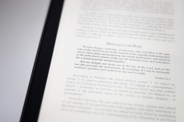 A close-up image of a book page with text focusing on meditation and scriptural interpretation. The text is primarily in black font, with some headings in a larger or bold type. The page is well-lit, capturing the details of the printed words.