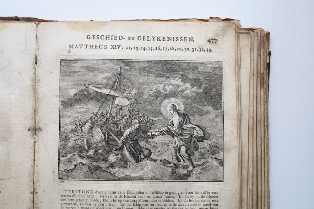 um livro velho com uma imagem de um homem em um barco