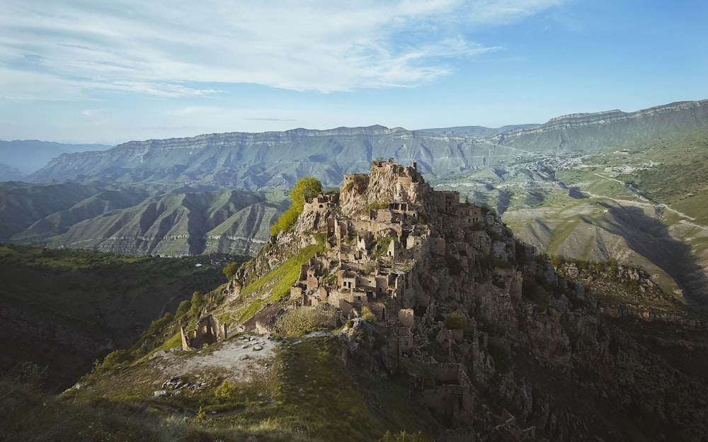 a mountain with a very tall rock structure on top of it