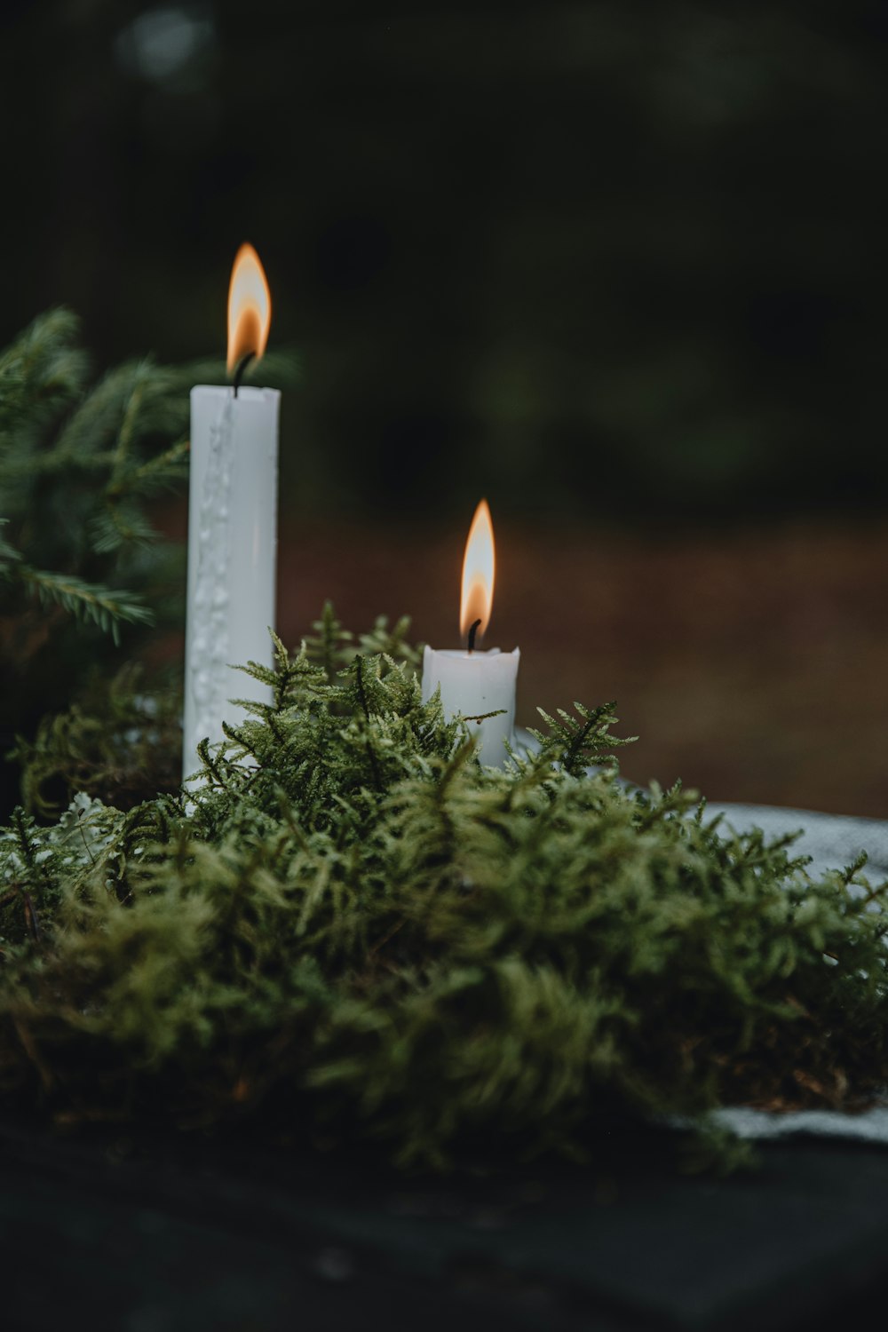 a couple of candles sitting on top of a table