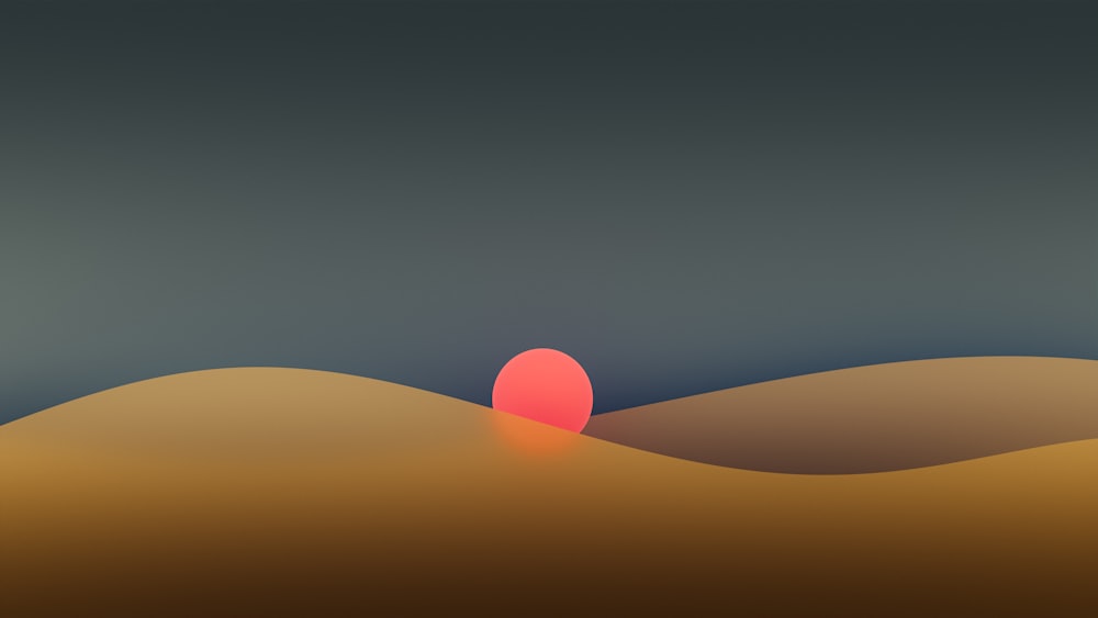 a red ball is in the middle of a desert