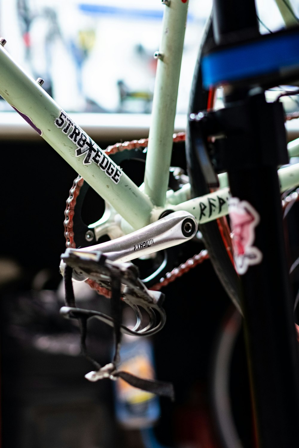 a close up of a bicycle parked in a parking lot