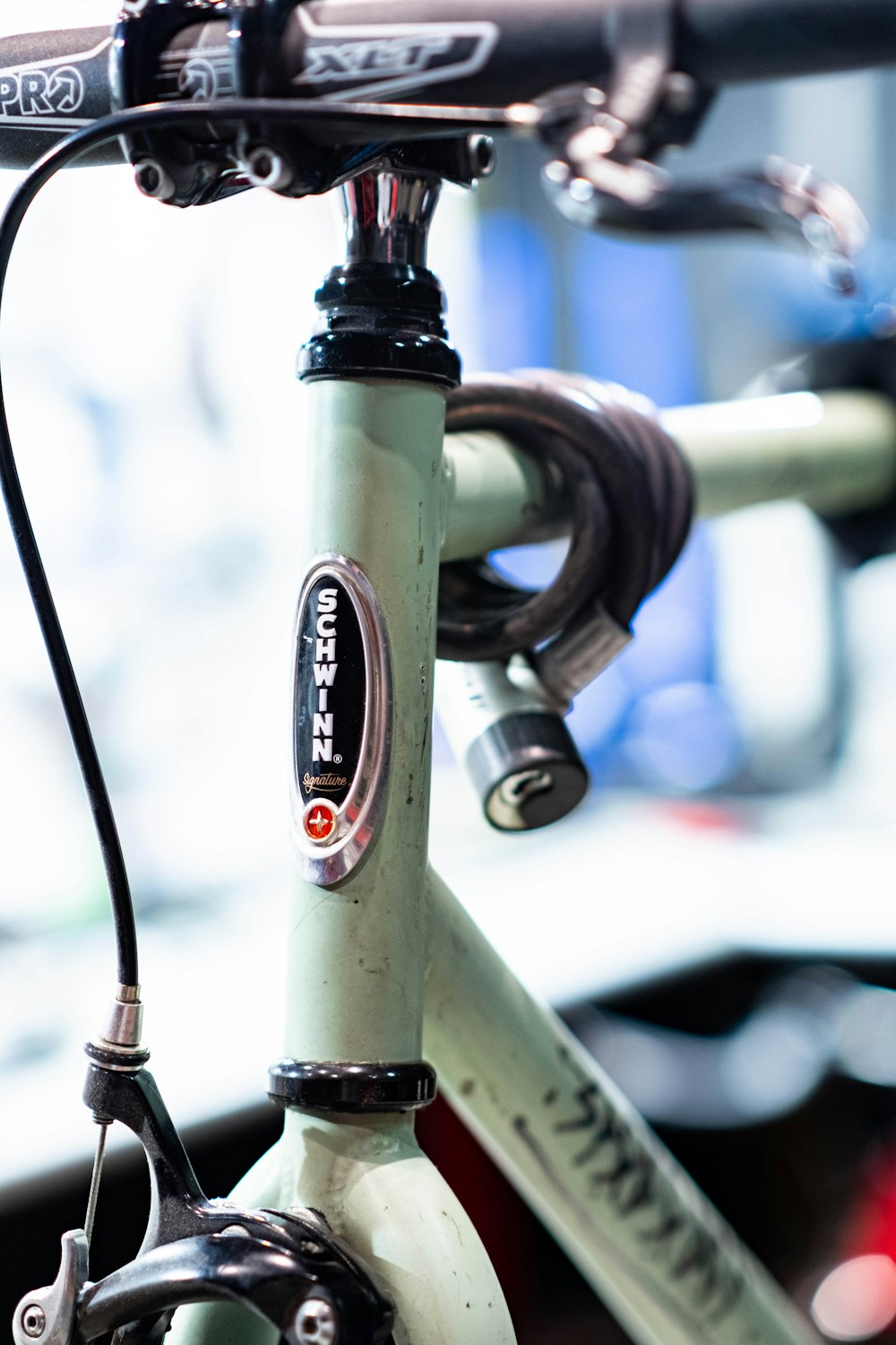 a close up of a bike handlebar with a blurry background