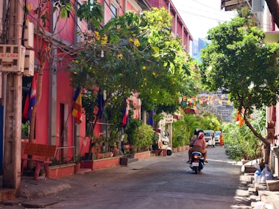 a person riding a motorcycle down a street