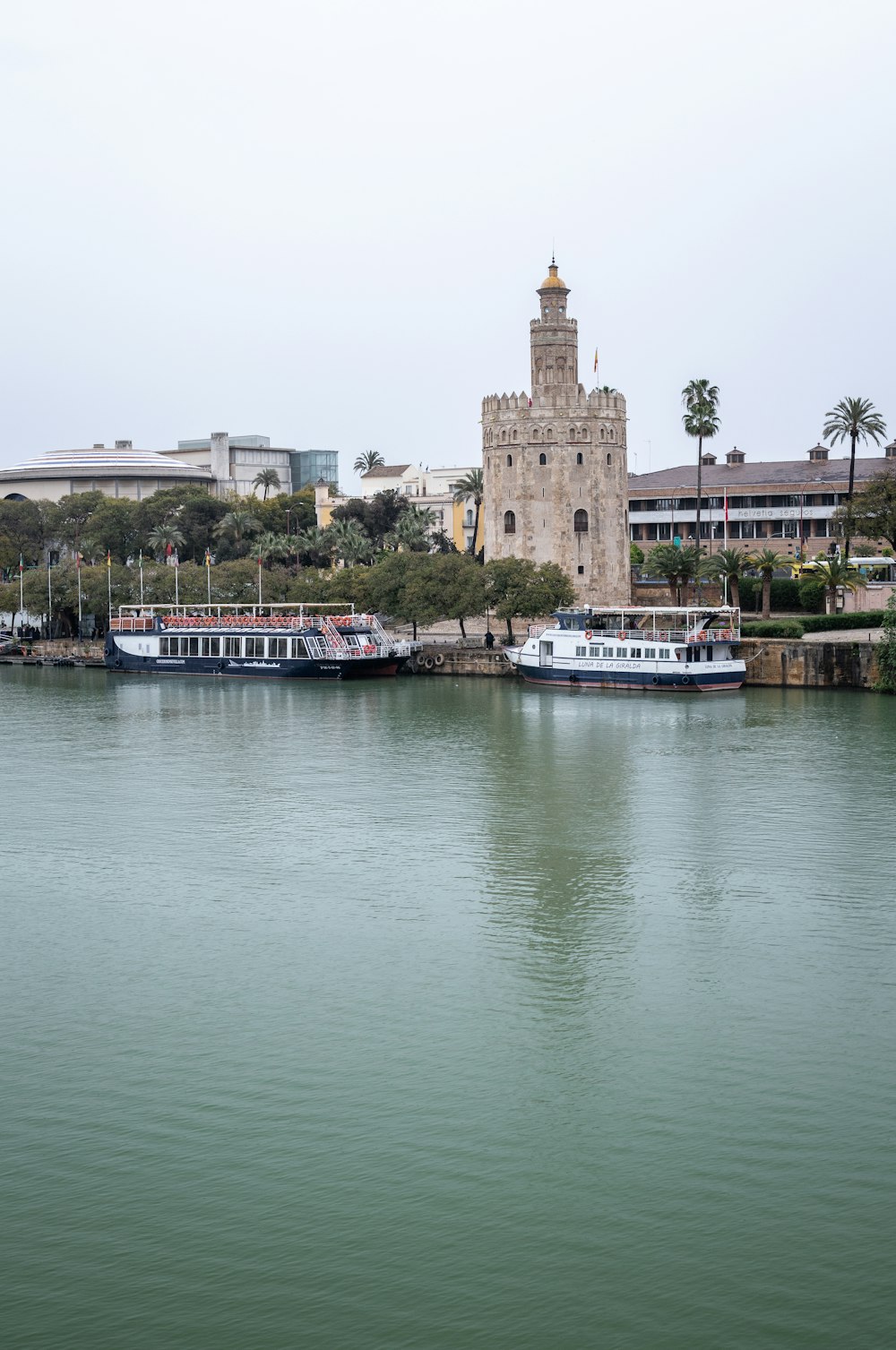 a large body of water with a tower in the background