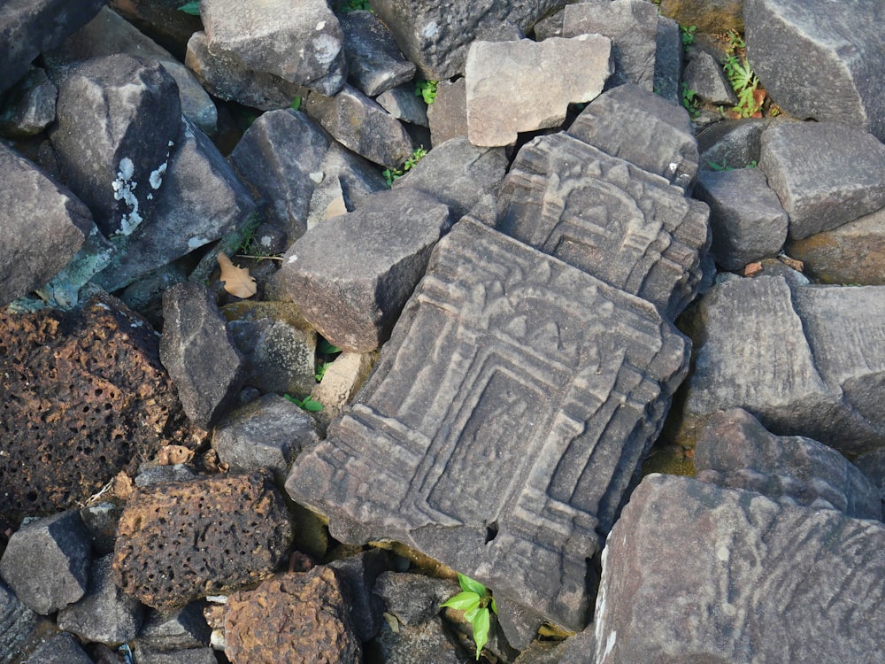 a close up of some rocks with writing on them