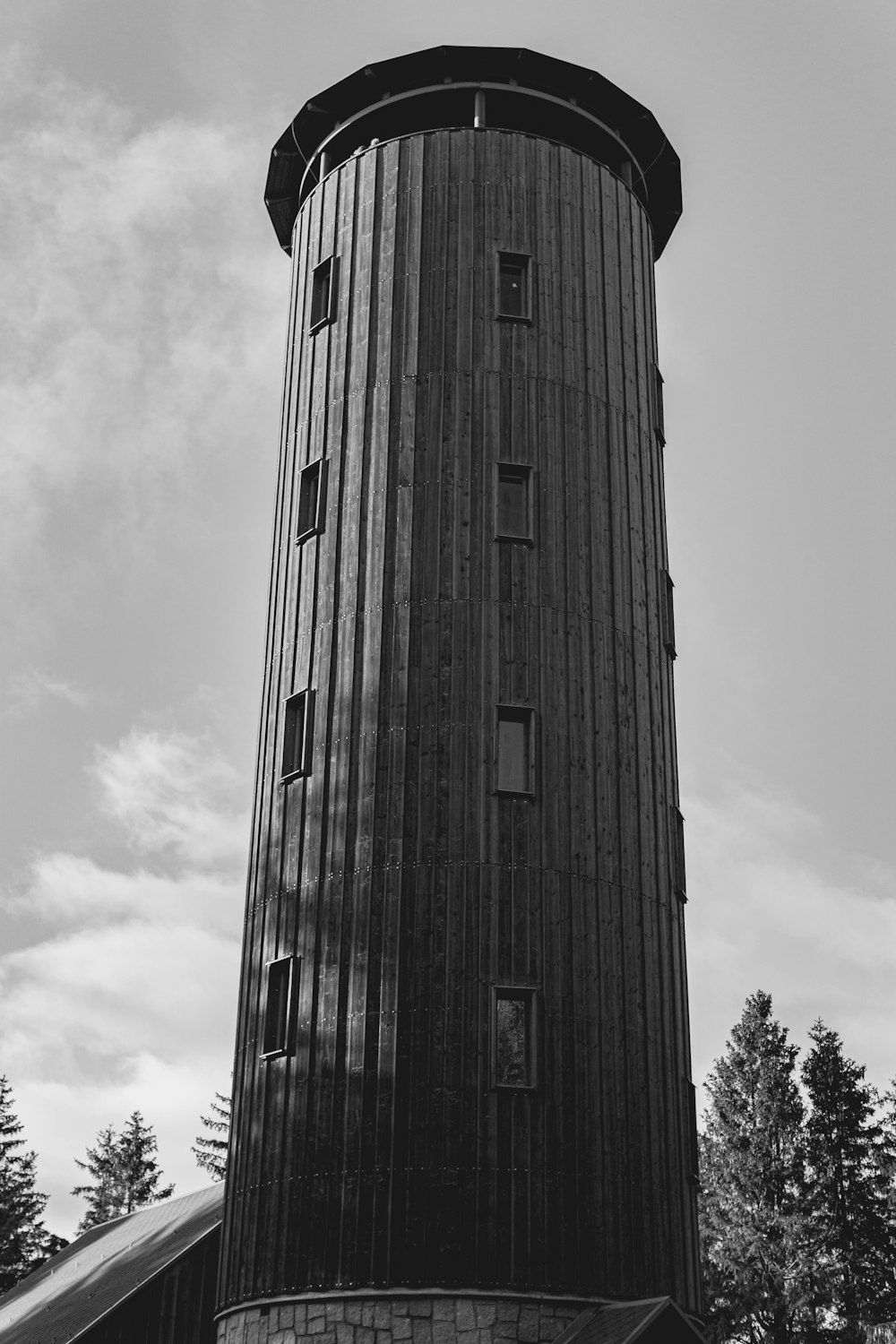 a black and white photo of a tall tower