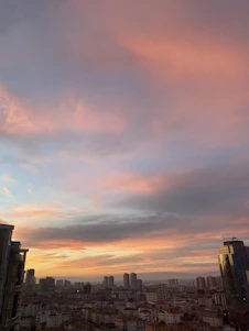 Elegant modern Colombian urban skyline at dusk with warm lighting and subtle golden accents.