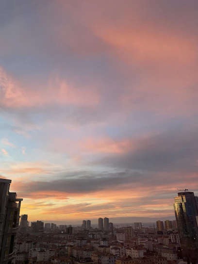 Elegant modern Colombian urban skyline at dusk with warm lighting and subtle golden accents.