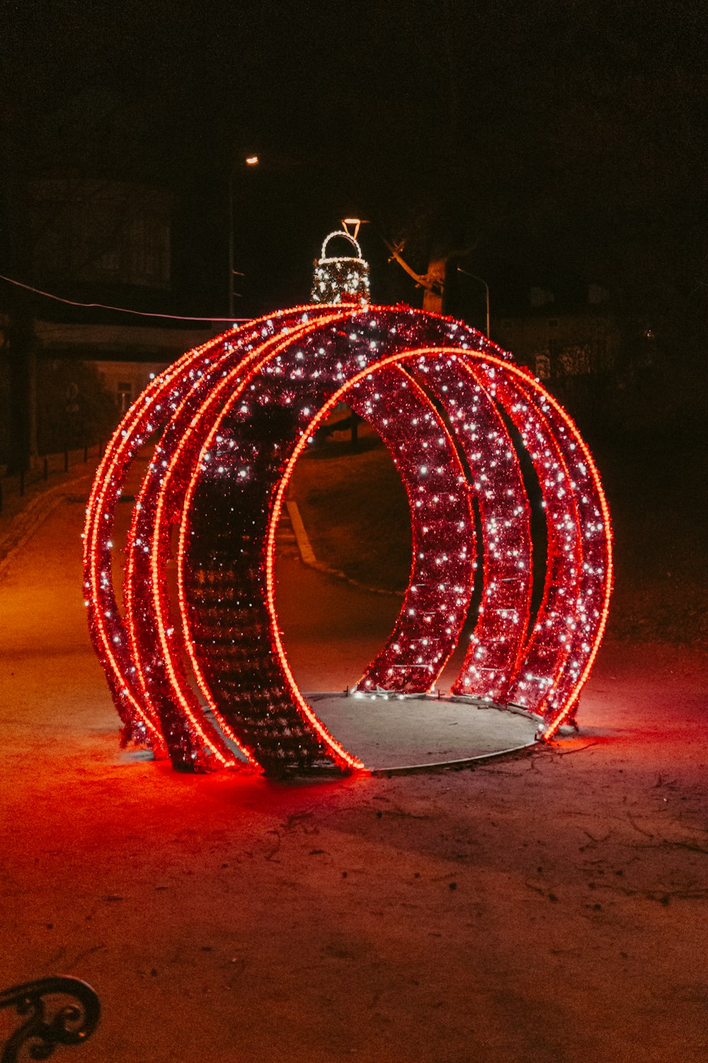 a sculpture made out of lights in the middle of a street