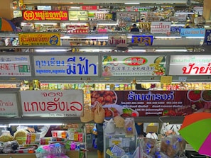 Photo of a bustling Malaysian wholesale market with Interasia Supply Chain banners