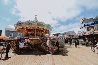 A colorful kiosk-style seven cart at a lively fair near the City of Arts and Sciences.